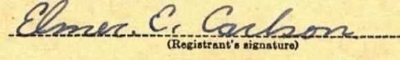 Elmer E. Carlson, signed in ink on the registrant’s signature line of the card.